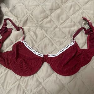 It does not fit me. Pretty maroon bralette from PLT. It is a Medium.